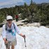 Joan climbs the final snow patch at the summit Joan climbs the final snow patch at the summit